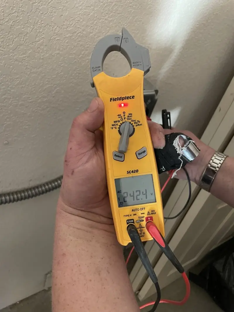 Voltage testing with clamp meter during Generator Installation in Huntington Park